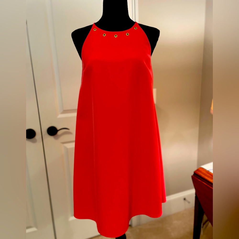 White House Black Market coral halter dress with gold accents.